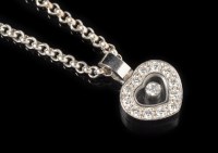 Lot 731 - A Chopard Happy Diamond's heart-shaped pendant,...