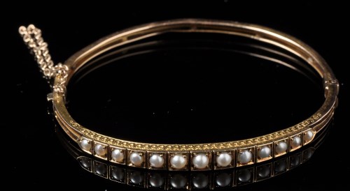 Lot 733 - A Victorian half-peal and yellow metal bangle,...