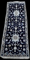 Lot 744 - A Nain runner, with ivory floral scrolls on a...