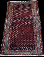 Lot 750 - A Malaya rug, the blue ground decorated with...