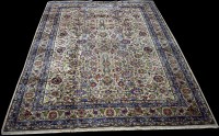 Lot 764 - A Kashan carpet, the cream ground with floral...