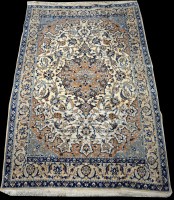 Lot 776 - A Nain rug, the blue and brown foliate scrolls...