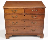 Lot 801 - A late Georgian mahogany chest of two short...