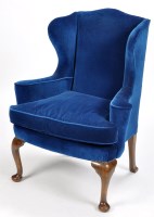 Lot 803 - A wing easy chair, covered in electric blue...