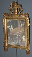 Lot 811 - A gilt frame wall mirror, surmounted by a...