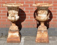 Lot 835 - A pair of early 20th Century cast iron urns,...