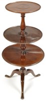 Lot 887 - A Georgian mahogany three-tier dumb waiter,...