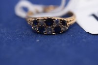 Lot 103 - A sapphire and diamond ring, set with fice...