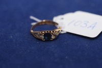 Lot 103A - A sapphire and diamond ring, the oval facet...