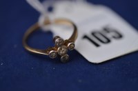 Lot 105 - A diamond engagement ring, set with five old...