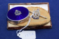 Lot 122A - A diamond and enamel set white metal Royal...