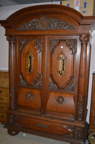 Lot 467 - A large continental carved oak cabinet with...