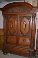 Lot 467 - A large continental carved oak cabinet with...