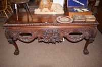 Lot 546 - An Oriental carved and stained wood console...