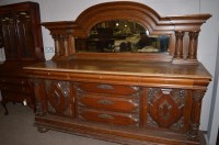 Lot 571 - A large heavily carved and stained oak...