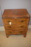 Lot 624 - Walnut serpentine front chest of drawers,...