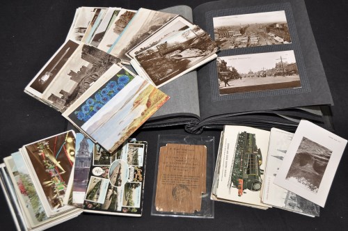 Lot 56 - An album of stocks and interest postcards and...