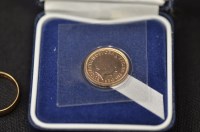 Lot 113 - Gold half sovereign, 2000; together with an 18...