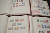 Lot 169 - Four volumes of The New Age Stamp Album...