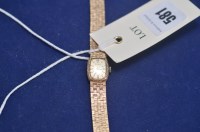Lot 581 - A 9ct. yellow gold lady's cocktail watch, by...