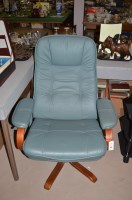Lot 967 - A pair of green leather upholstered easy...
