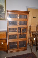 Lot 1143 - Rosewood finish sectional bookcase with glazed...