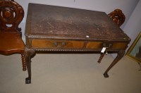 Lot 1162 - A 20th Century mahogany writing table in...