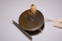 Lot 101 - A small brass 2 1/2in. fly fishing reel...