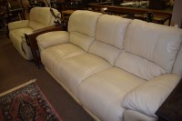 Lot 861 - Two cream leather reclining sofas, one...