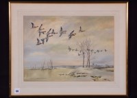 Lot 135 - Cecil Hodgkinson - geese in flight over a...