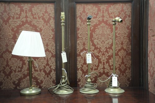 Lot 51 - Three matching brass table lamps (no shades);...