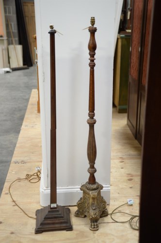 Lot 58 - A modern turned oak standard lamp on cast...