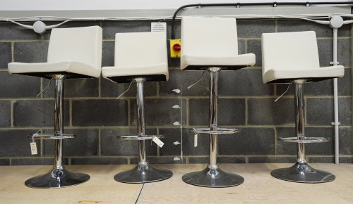 Lot 92 - A set of four modern bar stools, the seats and...