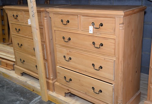 Lot 96 - A modern polished pine chest of drawers, the...