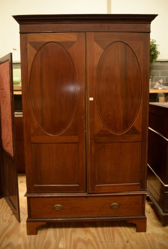 Lot 136 - A Georgian mahogany wardrobe with flared...