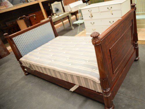 Lot 143 - A William IV mahogany bedstead, the panelled...