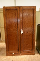 Lot 145 - A Victorian satin birch wardrobe with two...