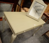 Lot 202 - A modern pale green painted dressing table...