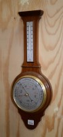 Lot 216 - A modern aneroid barometer and thermometer,...