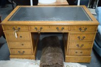 Lot 254 - A reproduction figured walnut pedestal desk,...