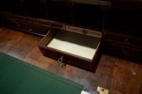 Lot 330 - A George I walnut bureau cabinet, the top with...