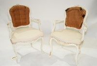 Lot 337 - Two Louis XV armchairs, painted white, with...