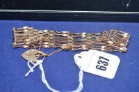 Lot 637 - A 9ct. yellow gold gate linked bracelet with...