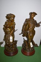 Lot 884 - A pair of bronzed figures of a huntsman and...