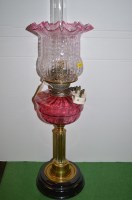 Lot 896 - Cranberry glass and brass corinthium column...