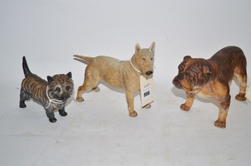 Lot 906 - Three Royal Doulton dog figures, a bulldog...