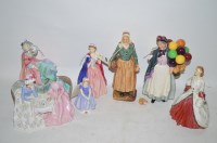 Lot 930 - Seven Royal Doulton figurines, to include:...
