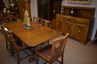 Lot 1180 - A stained and carved oak rectangular dining...