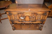 Lot 1217 - A reproduction oak side cabinet, possibly by...