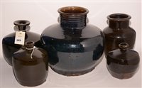 Lot 263 - Five glazed stoneware Chinese medicine pots.